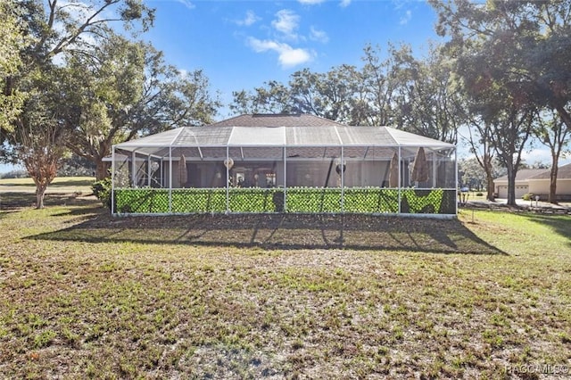 view of yard with glass enclosure