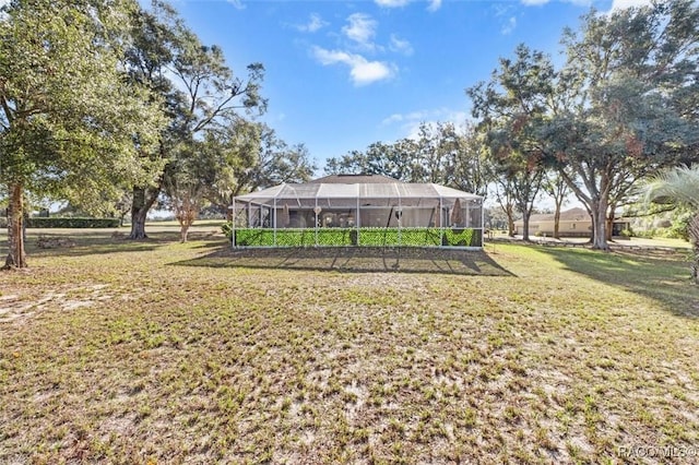 view of yard featuring glass enclosure