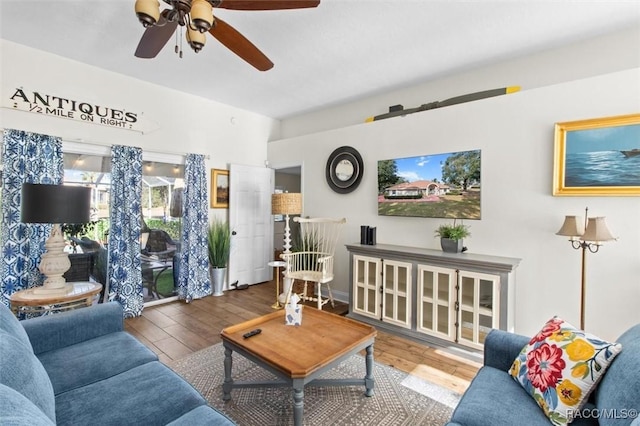 living room with ceiling fan and hardwood / wood-style floors