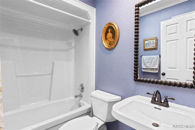 full bathroom featuring shower / bathtub combination, toilet, and sink