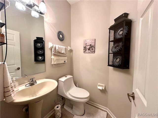 418 W Doerr Path, Hernando, FL 34442 - bathroom featuring baseboards, toilet, and tile patterned floors