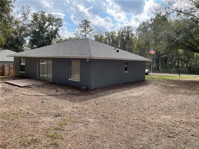 view of side of property with a patio