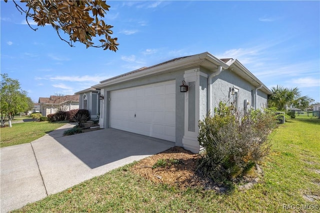 2083 NW 57th Ct, Ocala, FL 34482 - view of home's exterior with an attached garage, stucco siding, a yard, and concrete driveway