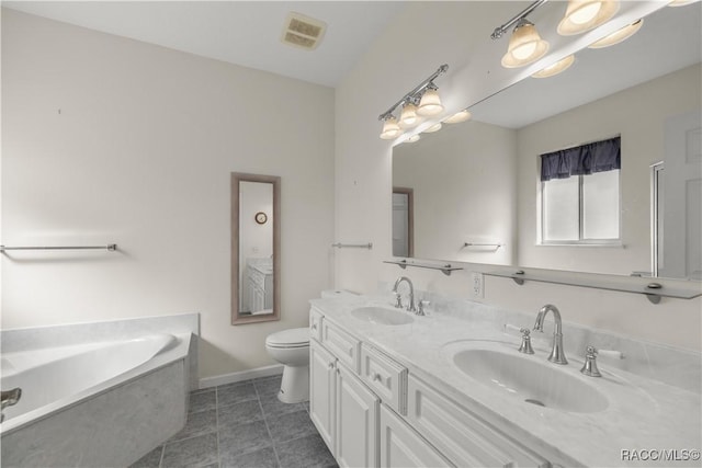 2083 NW 57th Ct, Ocala, FL 34482 - bathroom featuring visible vents, a sink, a bath, and double vanity