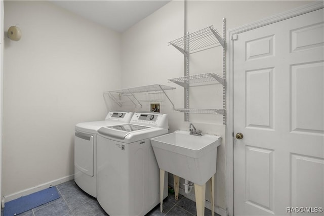 2083 NW 57th Ct, Ocala, FL 34482 - washroom featuring baseboards, tile patterned flooring, laundry area, and washing machine and clothes dryer