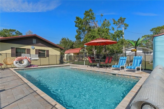 view of pool featuring a fenced in pool, a patio, and fence