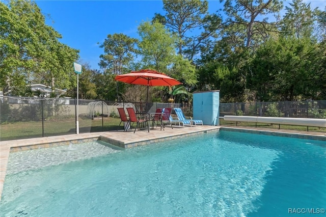 view of pool featuring a patio, fence, and a fenced in pool