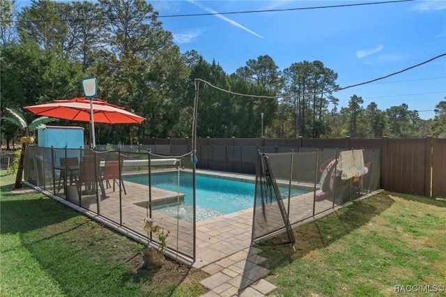 view of pool featuring a yard, a patio area, a fenced backyard, and a fenced in pool