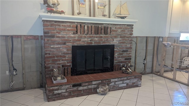 interior details featuring a brick fireplace