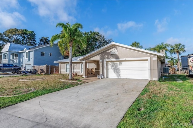 single story home featuring driveway, stucco siding, an attached garage, and a front yard