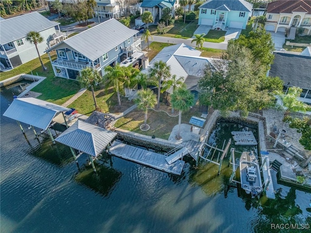 aerial view with a water view and a residential view