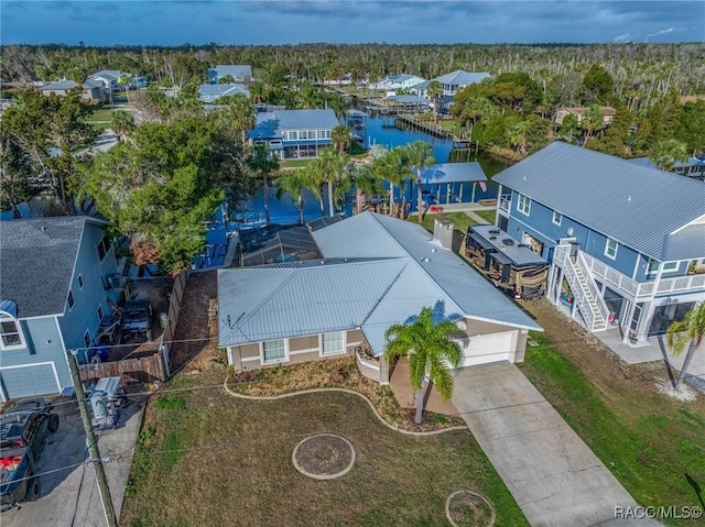 aerial view featuring a water view and a residential view