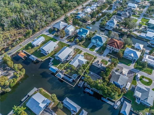 aerial view with a water view and a residential view