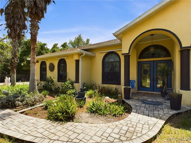 property entrance featuring french doors