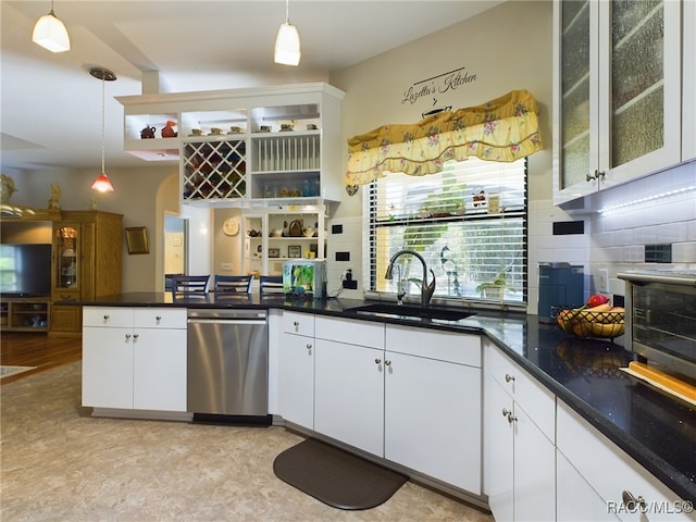 kitchen with pendant lighting, dishwasher, white cabinetry, and sink