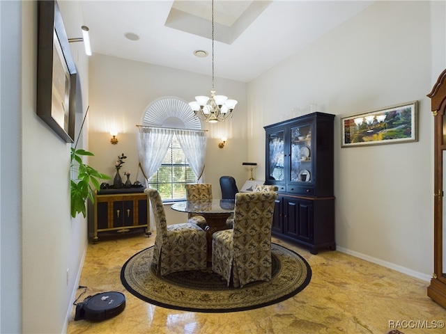 dining area with a notable chandelier