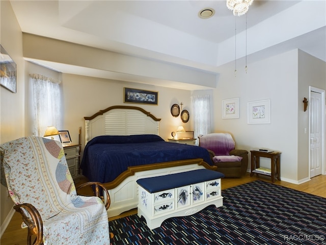 bedroom with wood-type flooring