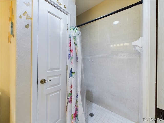 bathroom with a shower with shower curtain