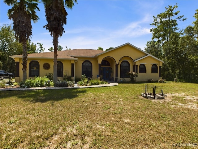 ranch-style house featuring a front lawn