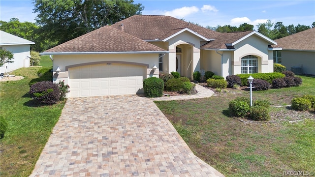 ranch-style house with a front yard and a garage