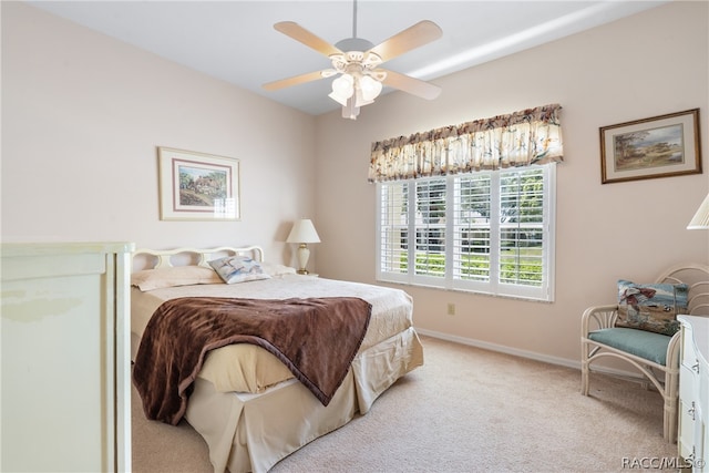 bedroom featuring light carpet and ceiling fan