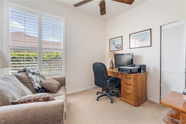 carpeted office with ceiling fan