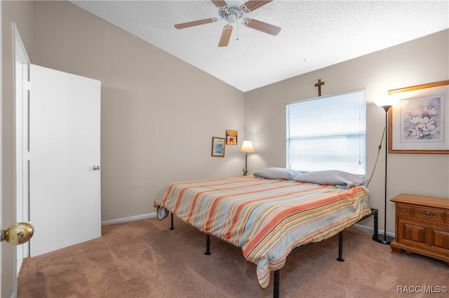 carpeted bedroom with ceiling fan, lofted ceiling, and a textured ceiling