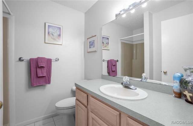 bathroom with tile patterned floors, walk in shower, a textured ceiling, vanity, and toilet