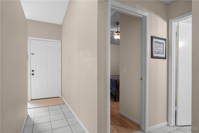 hallway featuring light tile patterned floors