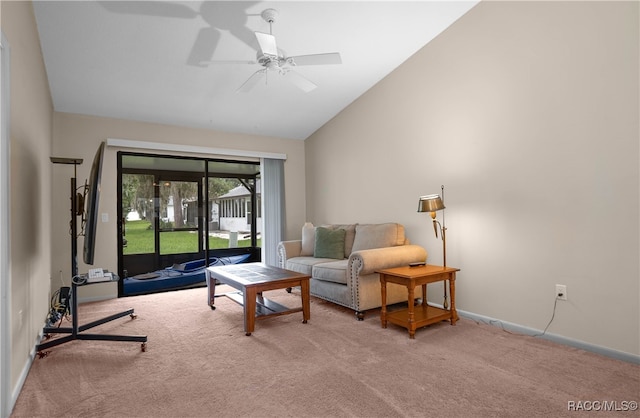 carpeted living room featuring ceiling fan and vaulted ceiling