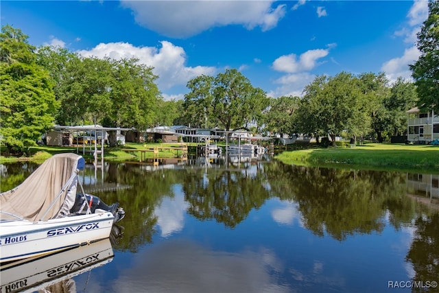 property view of water with a dock