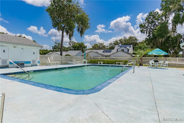 view of swimming pool featuring a patio