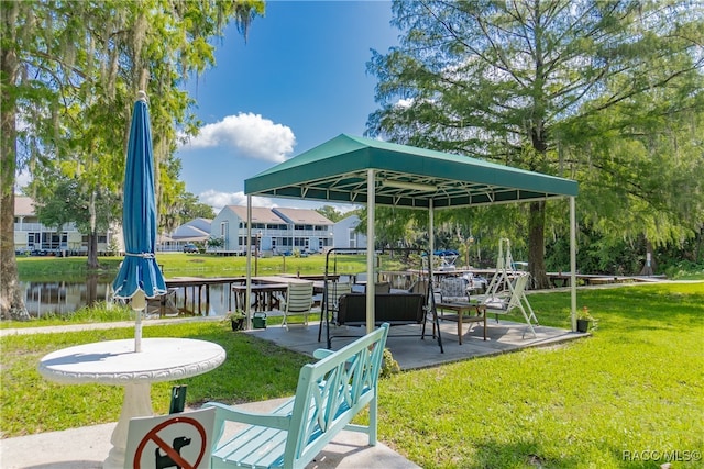 exterior space with a water view and a yard