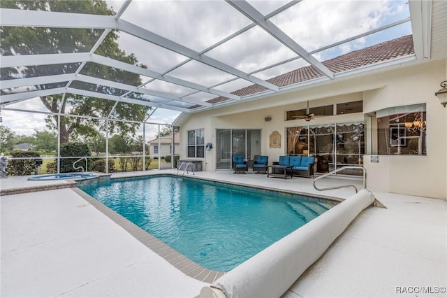 pool featuring an outdoor living space, a ceiling fan, a patio, glass enclosure, and an in ground hot tub