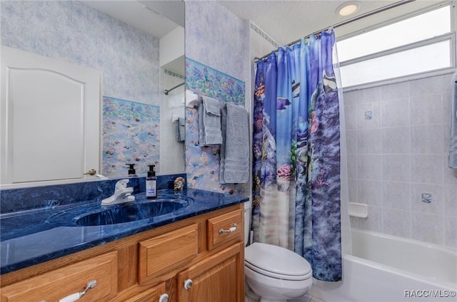 full bath with toilet, shower / tub combo, and vanity