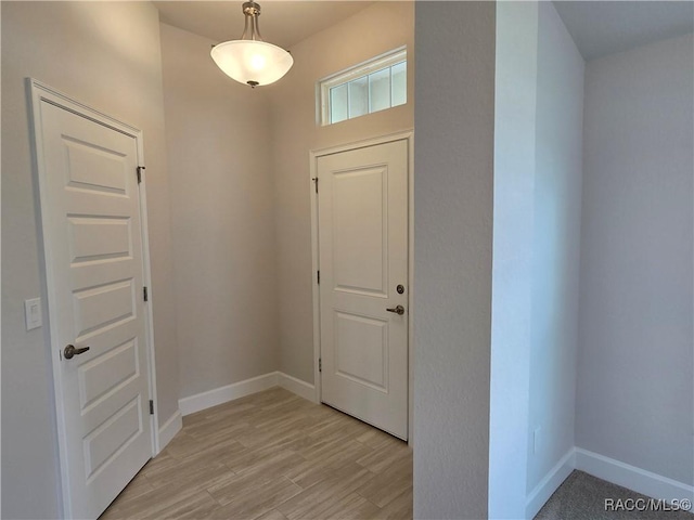 348 W Rexford Dr, Beverly Hills, FL 34465 - entryway with baseboards and light wood finished floors