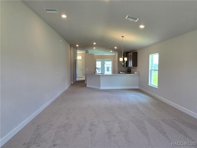 348 W Rexford Dr, Beverly Hills, FL 34465 - unfurnished living room with lofted ceiling, light carpet, recessed lighting, and a chandelier