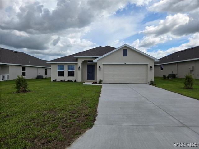 348 W Rexford Dr, Beverly Hills, FL 34465 - ranch-style home featuring stucco siding, concrete driveway, an attached garage, a front yard, and a shingled roof