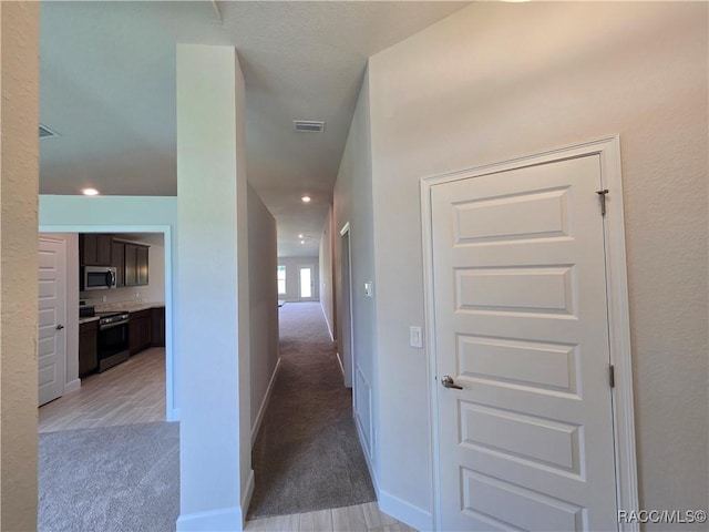 348 W Rexford Dr, Beverly Hills, FL 34465 - hallway with light carpet
