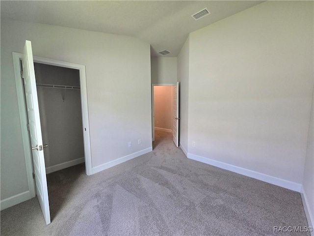 348 W Rexford Dr, Beverly Hills, FL 34465 - unfurnished bedroom with carpet floors, vaulted ceiling, and a closet