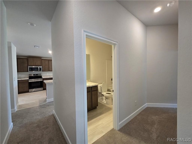 348 W Rexford Dr, Beverly Hills, FL 34465 - hall featuring light colored carpet and recessed lighting