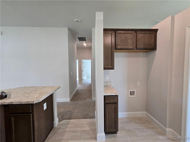 348 W Rexford Dr, Beverly Hills, FL 34465 - laundry room featuring hookup for a washing machine and baseboards