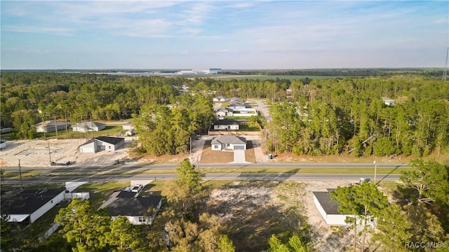 bird's eye view featuring a residential view and a view of trees