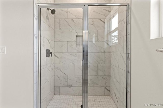 bathroom featuring an enclosed shower