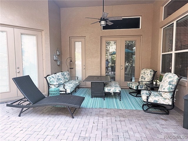 view of patio featuring ceiling fan and french doors