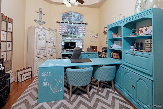 office area with ceiling fan and dark wood-type flooring