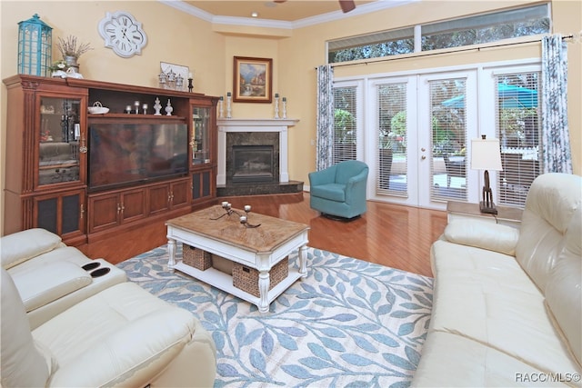 living room with hardwood / wood-style floors, french doors, and ornamental molding