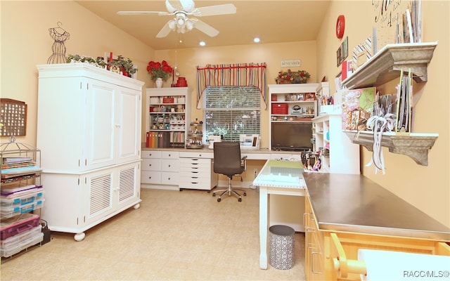 office area with ceiling fan and built in desk