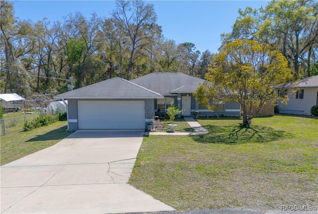 single story home with stucco siding, fence, concrete driveway, a front yard, and a garage