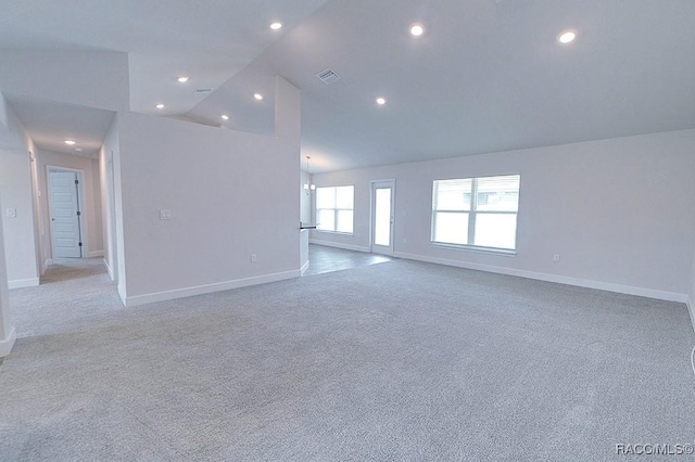 8330 N India Way, Citrus Springs, FL 34434 - spare room featuring light colored carpet, lofted ceiling, baseboards, and recessed lighting